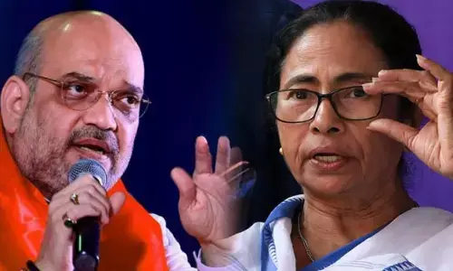 गुवाहाटी में अमित शाह का मेगा रोड शो, कहा - असम में फिर बनेगी BJP की सरकार, 90 से ज्यादा सीटों पर होगी जीत