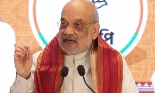 गुवाहाटी में अमित शाह का मेगा रोड शो, कहा - असम में फिर बनेगी BJP की सरकार, 90 से ज्यादा सीटों पर होगी जीत